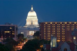 Skyline of Madison, WI Concourse Hotel at night with state capital in background